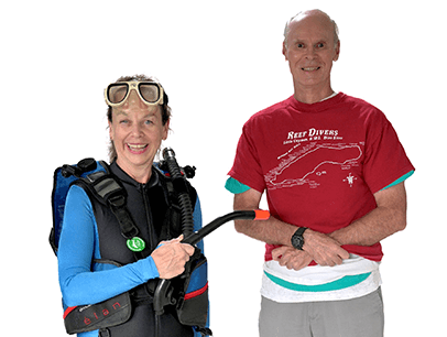 Woman in scuba gear next to man in red shirt