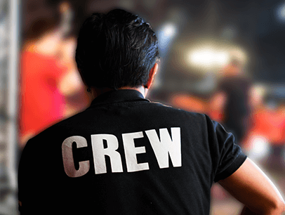 Person wearing shirt with crew on back