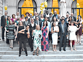 Group of people posing on steps