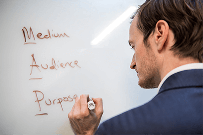 Man writing on whiteboard