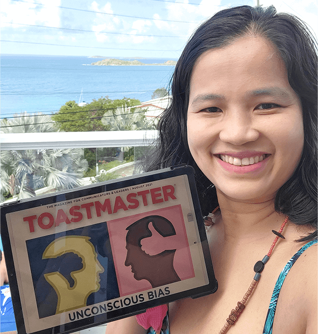 Rowena Garcia of Elmhurst, New York, enjoys the Toastmaster online magazine while overlooking the Caribbean Sea on vacation in St. Thomas.