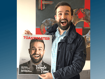 Stephan Dyer, DTM, of North York, Ontario, Canada, holds a printout of the February 2021 Toastmaster magazine cover he appeared on.