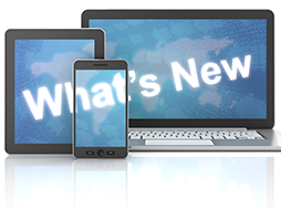 Laptop, tablet, and smartphone with what's new on screens
