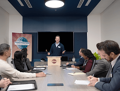 Man speaking to group from lectern